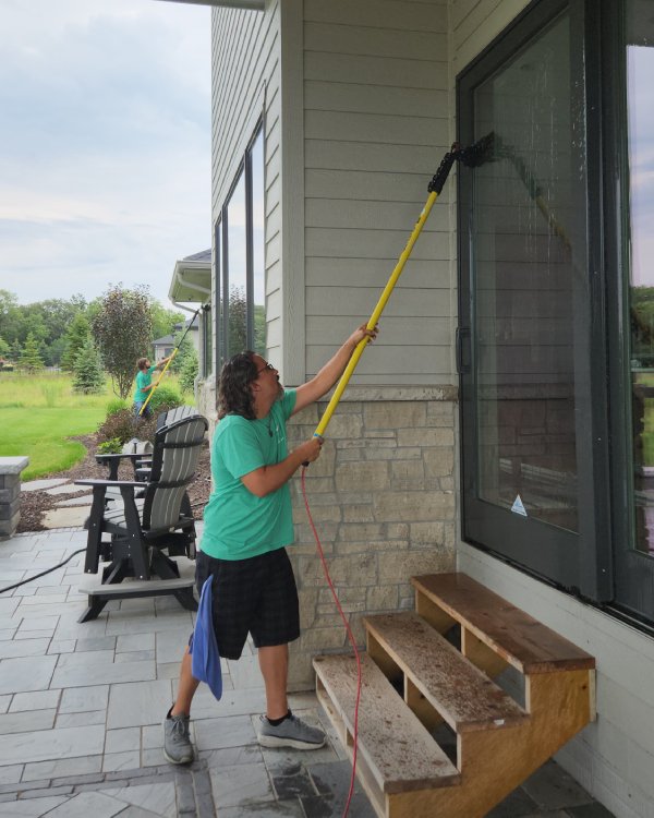 Grace Window Cleaning crew in action with Water Fed Pole (WFP) system