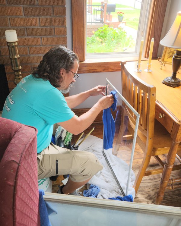 local window cleaning crew tony highly focused in an Omaha home